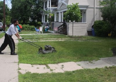 Residents work with NHS of New Haven on one of the many NeighborWorks Week projects planned