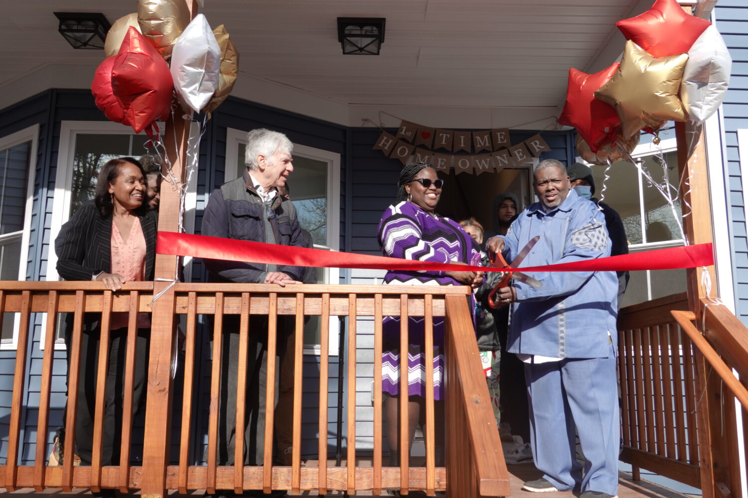 Glenn and Darlene Young attend NHS ribbon cutting ceremony for their new home.